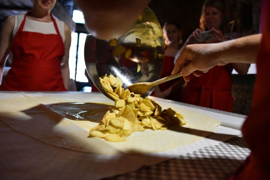 Cookies and Apple Strudel Cooking Class Including Lunch - Stretching the dough for apple strudel
