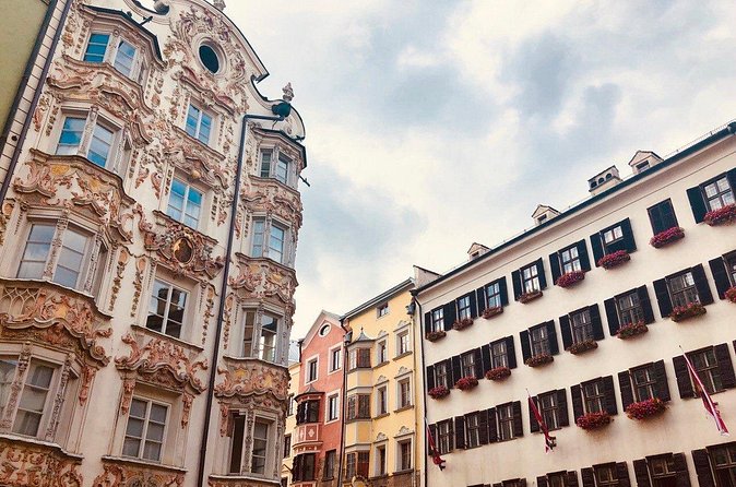Self-Guided 1,5-hour Tour of Innsbruck: Exciting Stories, Photo Spots & Desserts - Swarovski on Maria-Theresien-Straße
