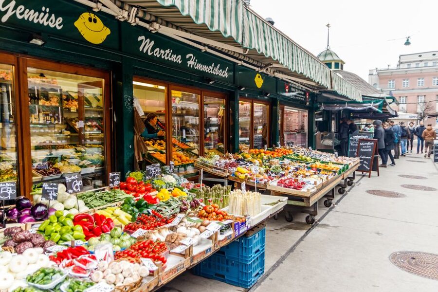 Vienna: Typical Austrian Food Tour with Coffee House Visit - Walking to Naschmarkt and tasting Austrian cheese