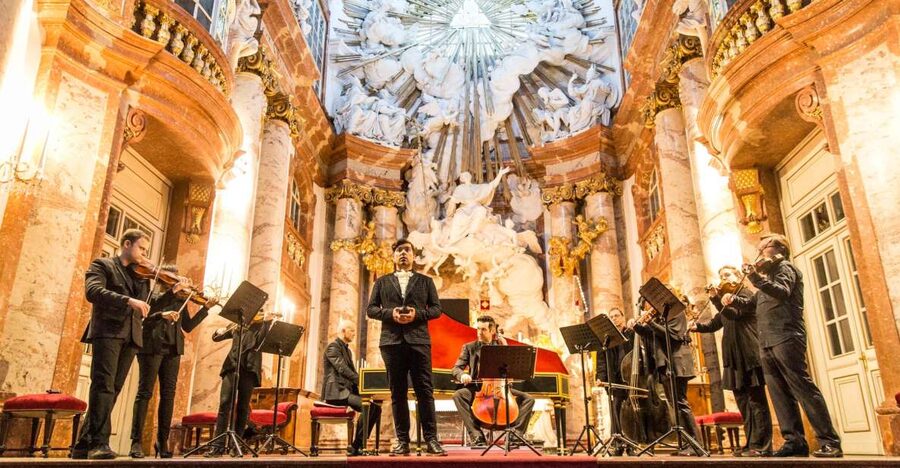 A small ensemble playing under the dome of Karlskirche in Vienna